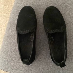 Black suede Minnetonka shoes .